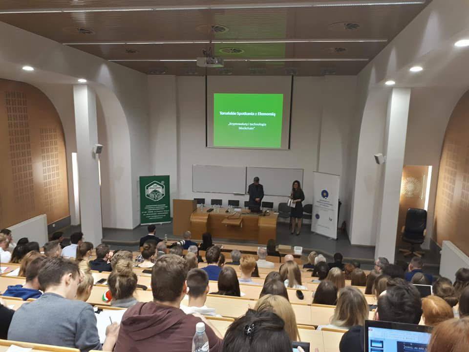 Audience watching a TechTalkSession presentation in a Toruń lecture hall
